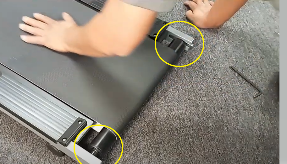 A person's hand on a treadmill

Description automatically generated with low confidence